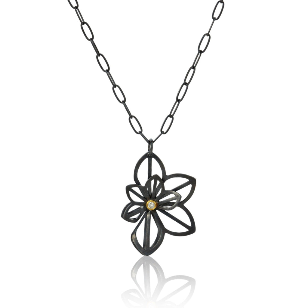 pendant in minnesota jewelry designer's Origami flower style made in oxidized sterling silver with post-consumer recycled diamond