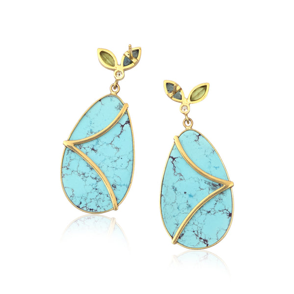 Karin Jacobson jewelry turquoise earrings with peridot and blue zircon flower tops, shown on white background. Back side.