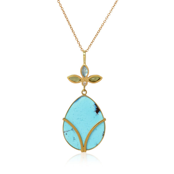 Karin Jacobson jewelry turquoise pendant with peridot and blue zircon flower top, shown on white background.  Back side.