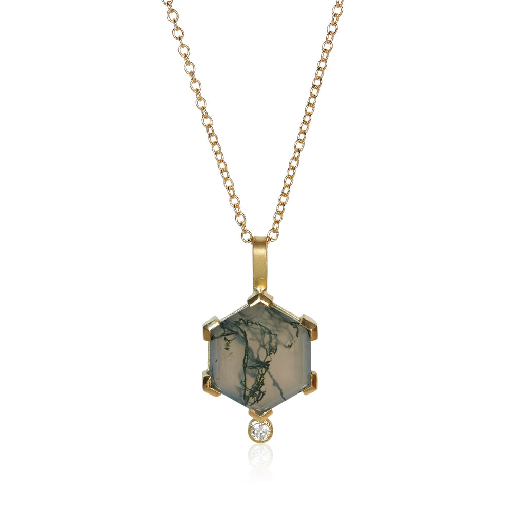 Pendant necklace with a hexagon moss agate showing green inclusions, accented by two small round diamonds, set in Fairmined 18k yellow gold.