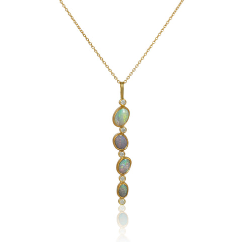 Karin Jacobson jewelry 4 opal and diamond pendant in 18k & 22k gold and sterling silver back, on 18k gold chain. Shown on white.