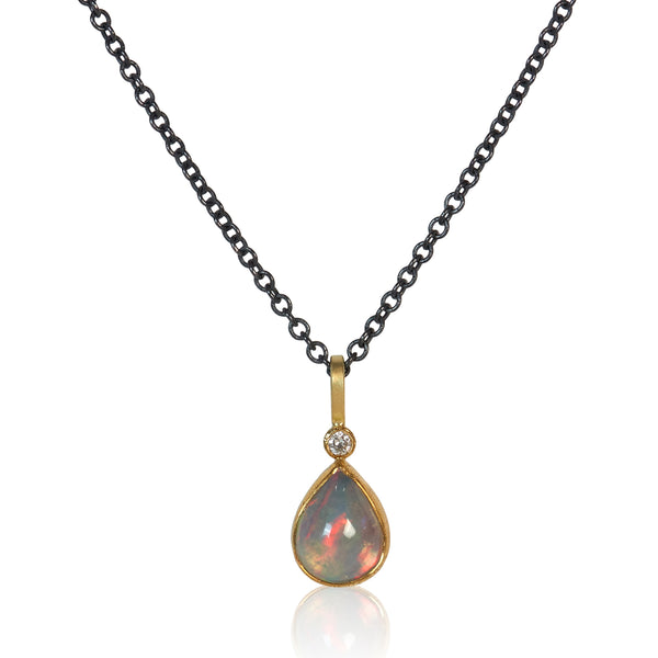teal, pink, and lavender pear-shaped ethiopian opal pendant with recycled diamond