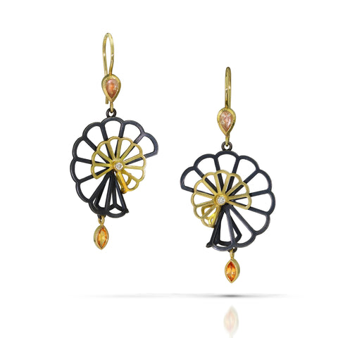 Sculptural Double Hyacinth Fold earrings in oxidized sterling silver and 18k yellow gold, featuring layered openwork floral shapes, peach-colored sunstones, orange spessartite garnet drops, and recycled diamond centers.