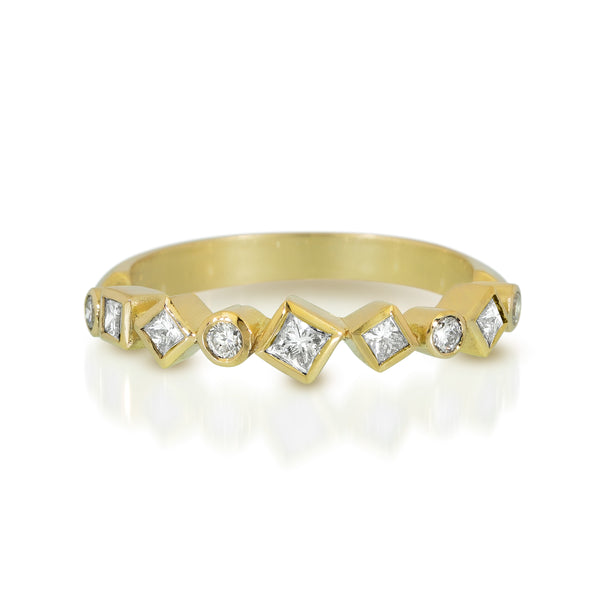 18k yellow gold Confetti ring with round and square post-consumer recycled diamonds totaling .44 ct arranged in a scattered pattern across the top of the band.