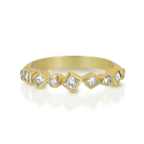 18k yellow gold Confetti ring with round and square post-consumer recycled diamonds totaling .44 ct arranged in a scattered pattern across the top of the band.