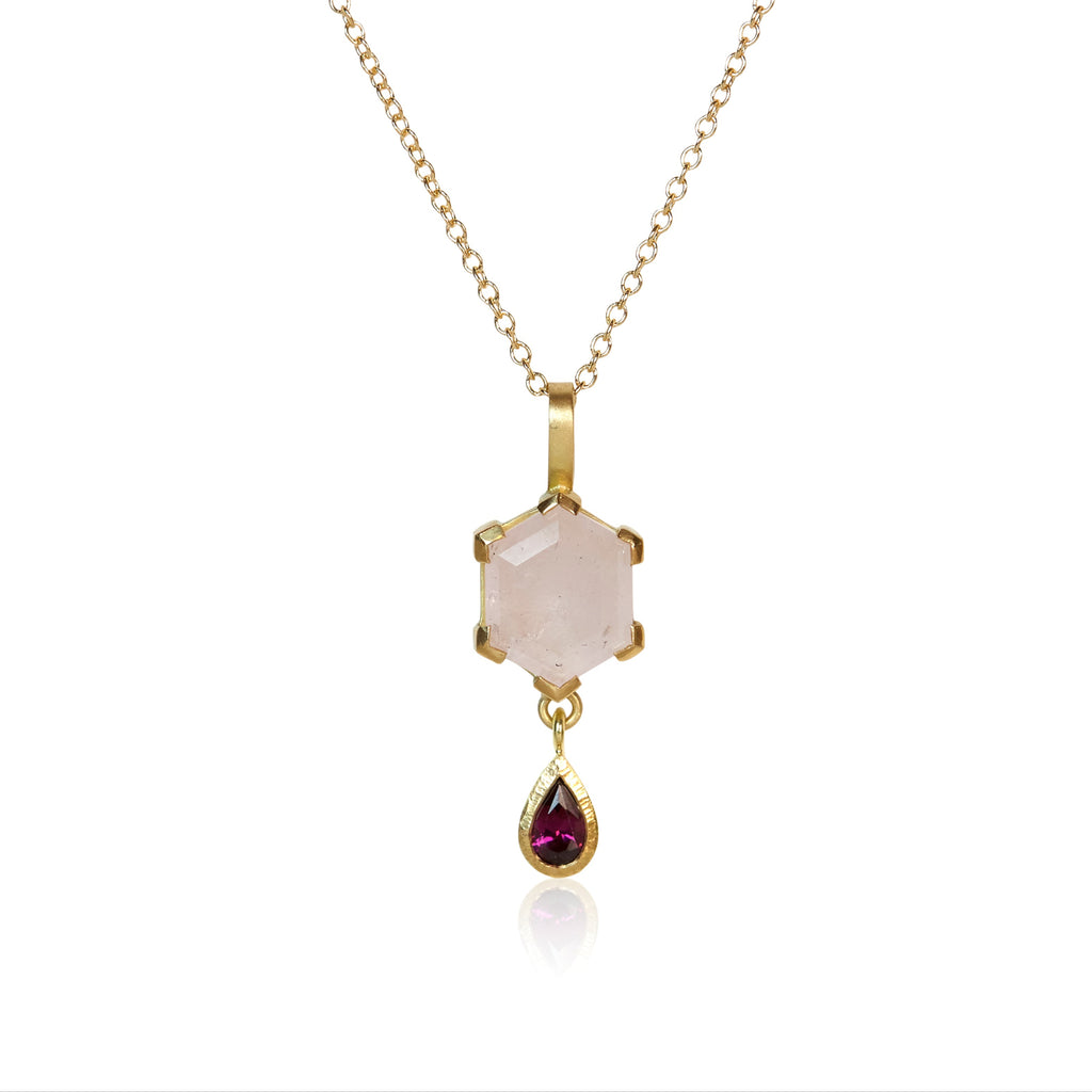 Pendant necklace with a hexagon-cut pale pink morganite and a pear-shaped magenta garnet drop, set in Fairmined™ 18k yellow gold.