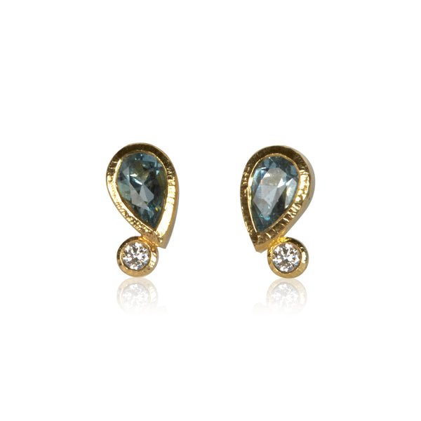Pair of 18k gold stud earrings with pear-shaped aquamarines totaling .35 ct and post-consumer recycled diamonds totaling .06 ct, arranged as mirrored Confetti designs.