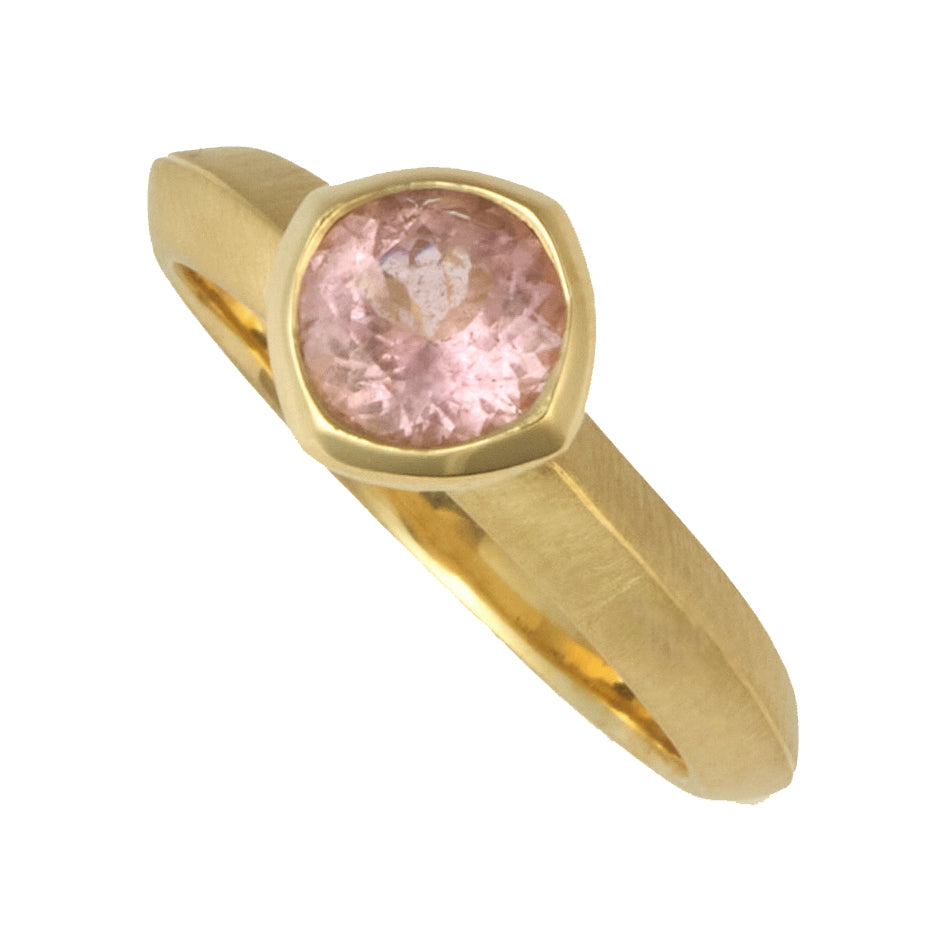 Photo of karin jacobson jewelry design California pink tourmaline bezel set solitaire ring in fairmined 18k yellow gold.