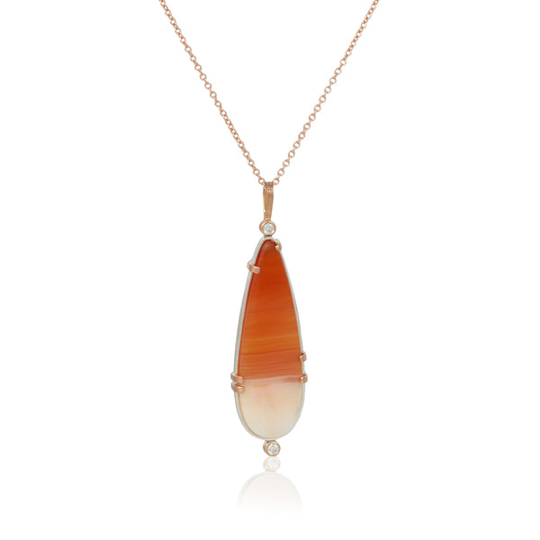 Necklace with a pendant featuring orange and white carnelian cabochon in sterling and 14k rose gold with diamonds on a white background - this shot shows the front of the pendant.