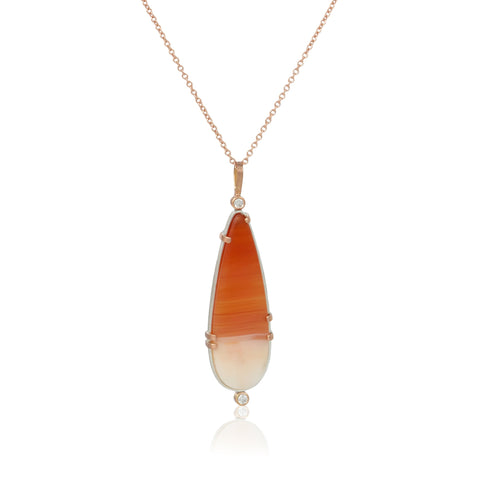 Necklace with a pendant featuring orange and white carnelian cabochon in sterling and 14k rose gold with diamonds on a white background - this shot shows the front of the pendant.