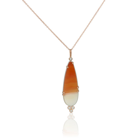 Necklace with a pendant featuring orange and white carnelian cabochon in sterling and 14k rose gold with diamonds on a white background - this shot shows the front of the pendant.