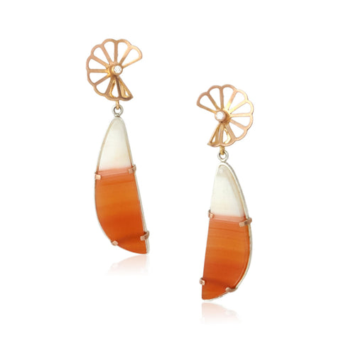 Pair of earrings with 14k rose gold tops with diamonds and orange and white teardrop shaped carnelian cabochon drops on a white background.