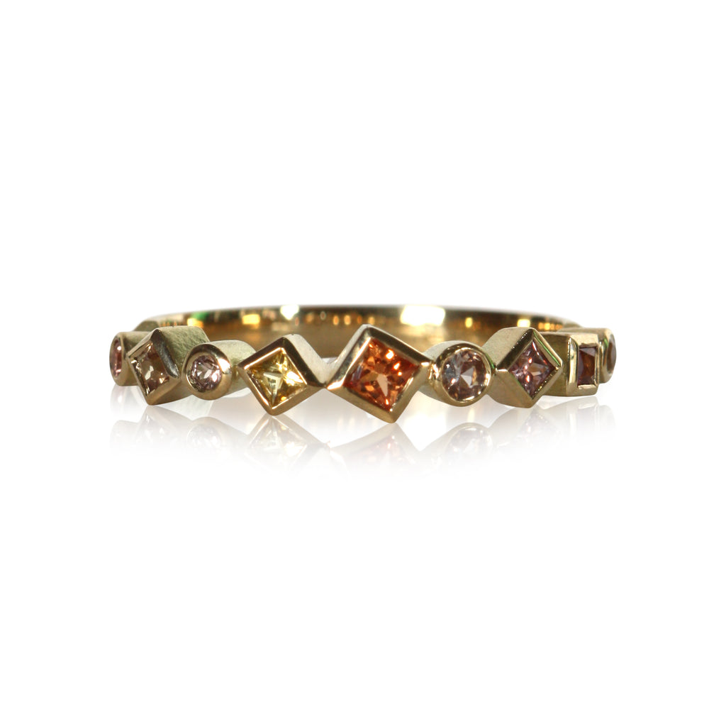 photo on white of a colored sapphire Confetti rings