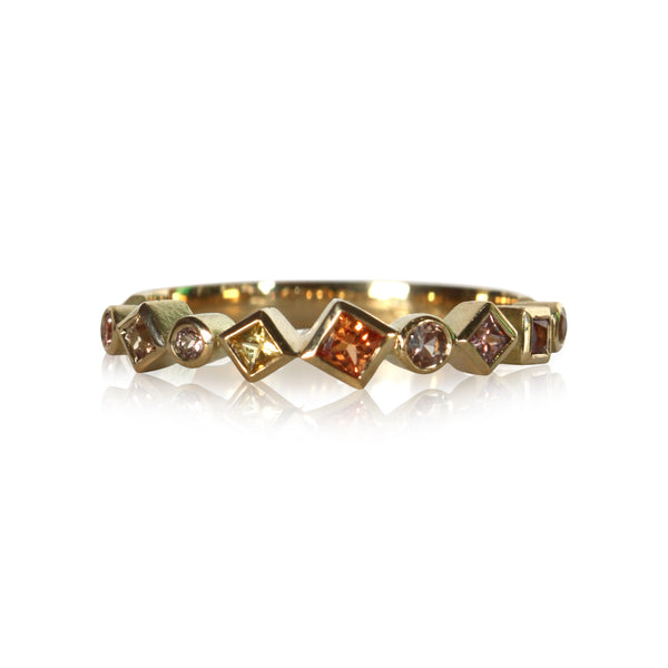 photo on white of a colored sapphire Confetti rings