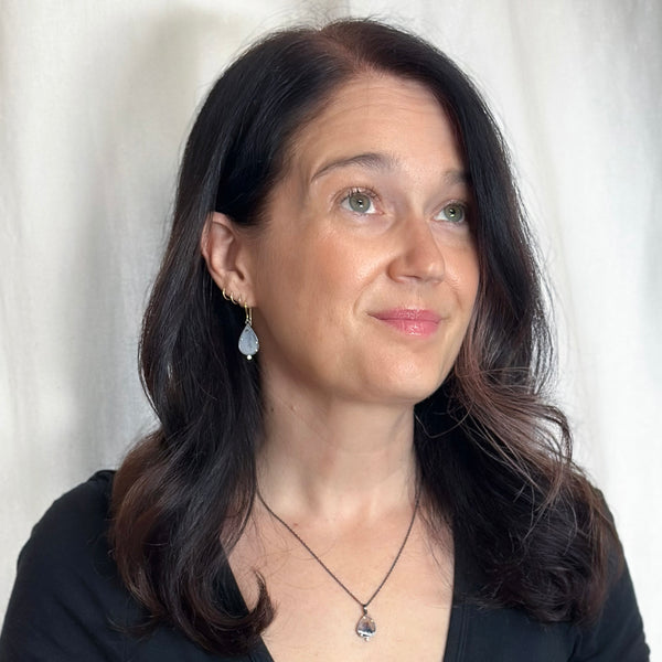 Pair of pear-shaped dendritic agate drop earrings in oxidized sterling silver with 18k yellow gold prongs, each accented with a small diamond below and finished with 18k gold French wires. Shown on model.