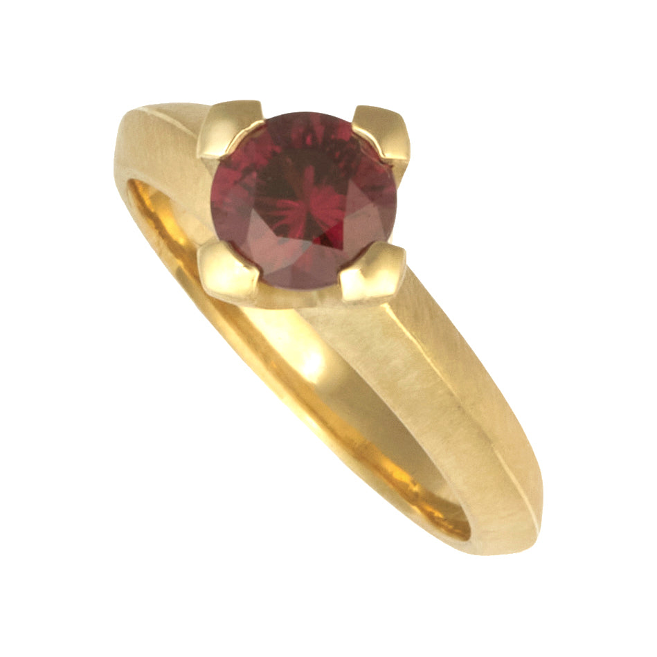 photo of Karin jacobson jewelry design Indian grape garnet round cut prong set solitaire ring in Fairmined™ 18k yellow gold.