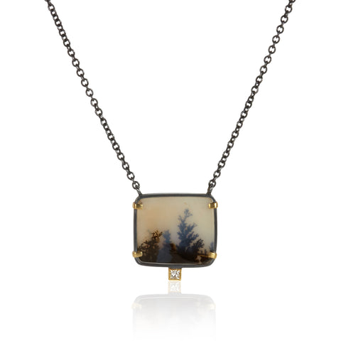 Rectangular dendritic agate pendant in oxidized sterling silver with 18k yellow gold prongs and a small diamond accent below, shown on an oxidized silver cable chain.