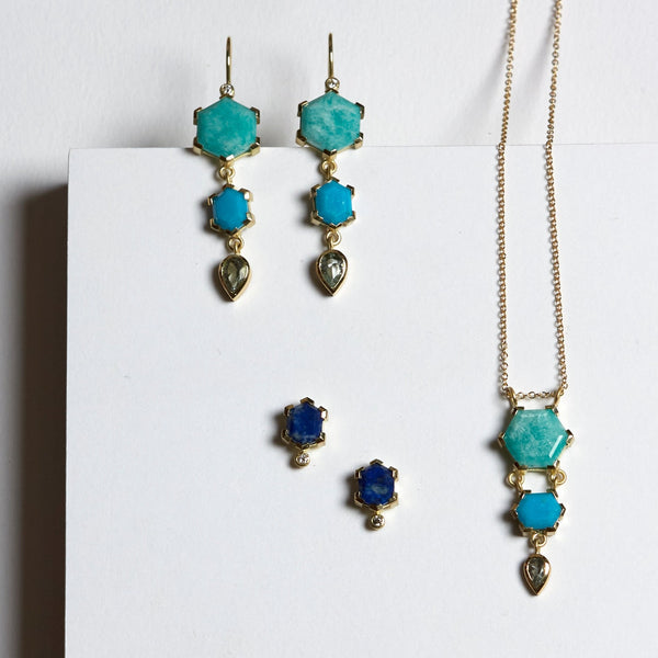 still life photo of karin jacobson jewelry chilean lapis hexagon stud earrings in fair mined 18k yellow gold with diamonds; amazonite, turquoise and aquamarine dangle earrings; and amazonite, turquoise and aquamarine dangle necklace