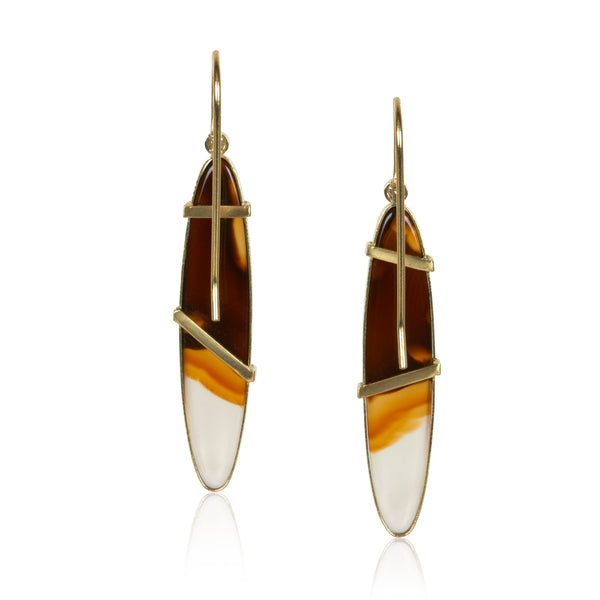 Elongated oval Montana agate earrings in Fairmined 18k yellow gold with diamond accents, featuring sweeping brown, amber, and white bands. backs
