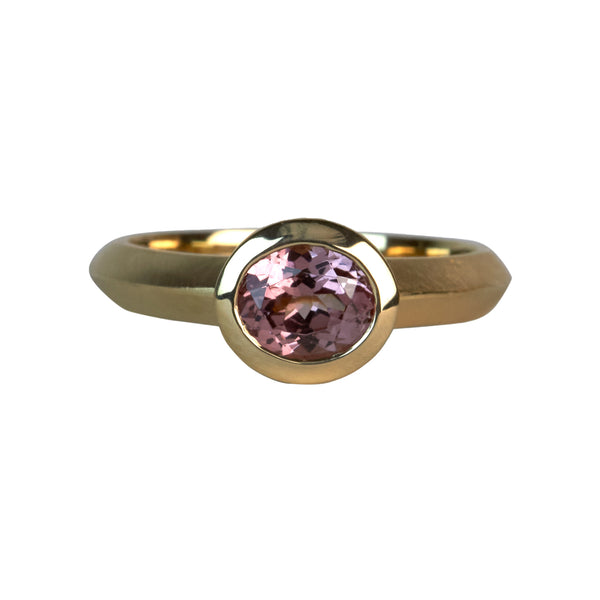 local jeweler made gold ring cast with malaya pink garnet solitaire
