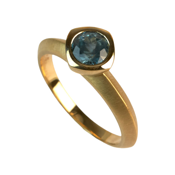 fairmined gold ring with blue green montana sapphire solitaire