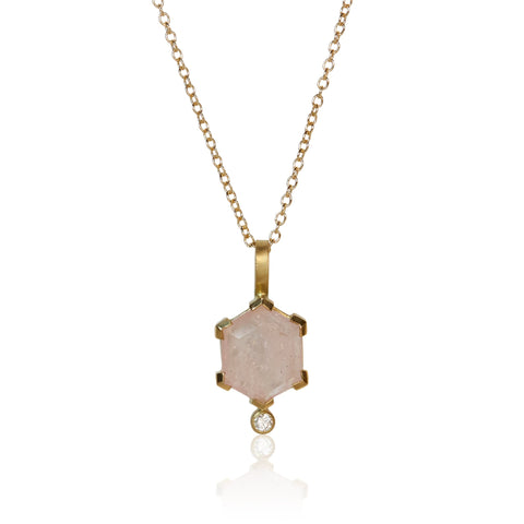 Pendant necklace with a hexagon-cut pale pink morganite and a small round diamond accent, set in Fairmined 18k yellow gold.