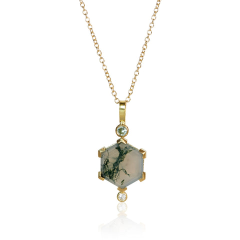 Pendant necklace with a hexagon moss agate, an Australian sapphire accent above, and a small round diamond below, set in Fairmined 18k yellow gold.