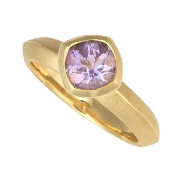 Photo of karin jacobson jewelry design Montana amethyst round bezel set solitaire ring in fairmined 18k yellow gold.