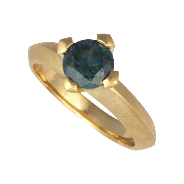 Photo of karin jacobson jewelry design Montana sapphire round prong set solitaire ring in fairmined 18k yellow gold.