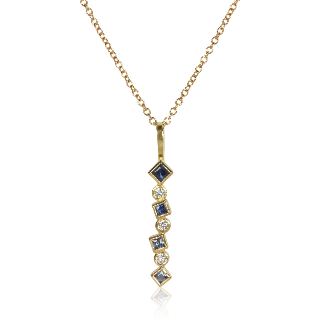 18k gold Confetti pendant with an ombré row of sapphires totaling .24 ct and scattered post-consumer recycled diamonds totaling .09 ct, shown on an 18k gold cable chain.