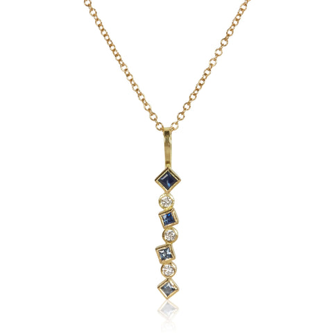 18k gold Confetti pendant with an ombré row of sapphires totaling .24 ct and scattered post-consumer recycled diamonds totaling .09 ct, shown on an 18k gold cable chain.