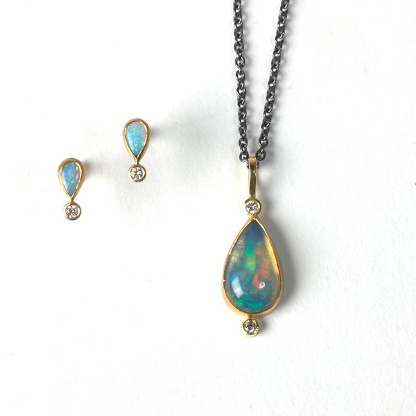 karin jacobson jewelry white cliff opal with two diamonds in 22k and 18k gold shown with petite pear opal and diamond studs