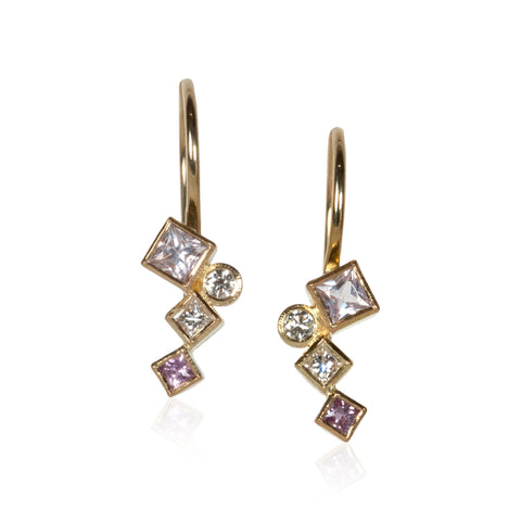 Pair of petite 18k gold dangle earrings with pink sapphires totaling .34 ct and post-consumer recycled diamonds totaling .14 ct, arranged in mirrored Confetti patterns and hanging from gold French wires.