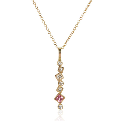 Vertical 18k gold pendant with Fair Trade Nigerian pink tourmaline totaling .13 ct and post-consumer recycled diamonds totaling .22 ct, arranged in a scattered Confetti pattern, shown on an 18k gold cable chain.