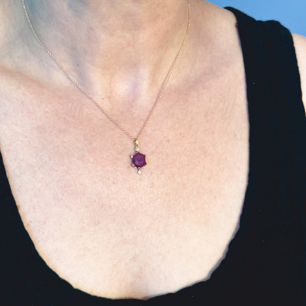 Karin Jacobson Jewelry ruby hexagon and recycled diamond necklace in 18k gold shown on model