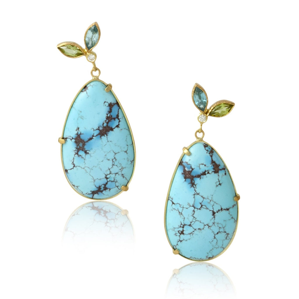 Karin Jacobson jewelry turquoise earrings with peridot and blue zircon flower tops, shown on white background.