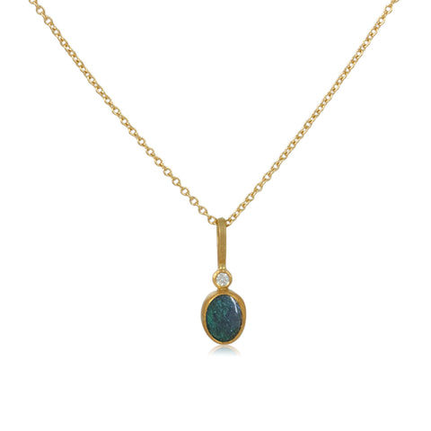 Karin Jacobson jewelry 1 opal and diamond pendant in 18k & 22k gold and sterling silver back, on 18k gold chain. Shown on white.