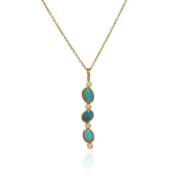 Karin Jacobson jewelry 3 opal and diamond pendant in 18k & 22k gold and sterling silver back, on 18k gold chain. shown on white