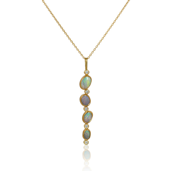 Karin Jacobson jewelry 4 opal and diamond pendant in 18k & 22k gold and sterling silver back, on 18k gold chain. Shown on white.