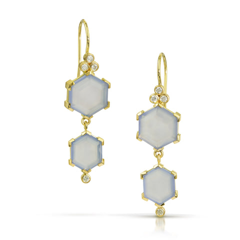 Photo of karin jacobson jewelry design hexagon shaped chalcedony cabochon and diamond earrings in Fairmined™ 18k yellow gold. Each earring has two chalcedony hexagons (one on top of the other) with a cluster of three diamonds at the top under the french wires, and a single diamond on the bottom.