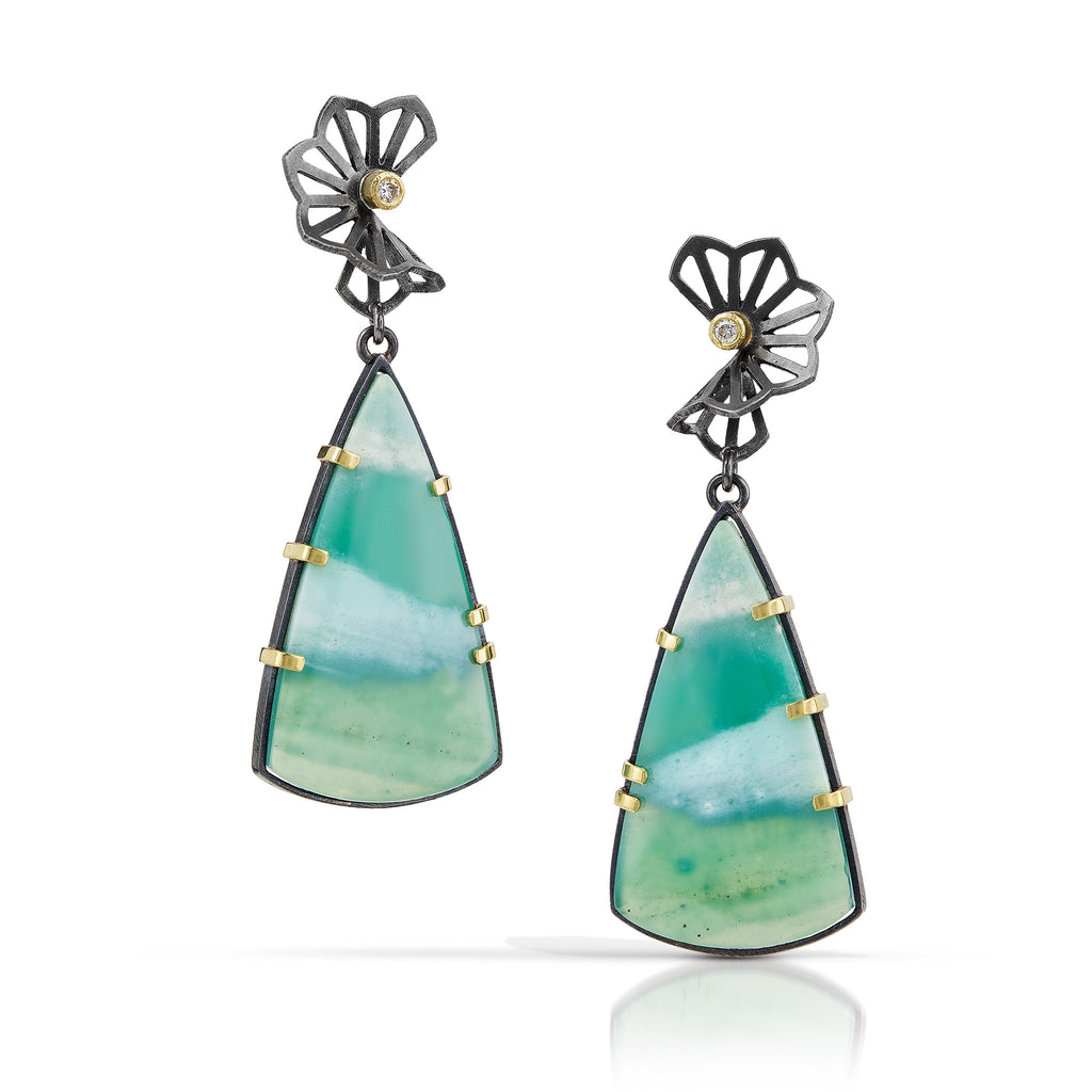  Photo of karin jacobson jewelry design opalized wood earrings with petite hyacinth fold tops. in sterling silver and 18k yellow gold with 2 diamonds. the opalized wood is triangle shaped with teal and white stripes. 