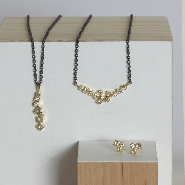 Photo of karin jacobson jewelry design diamond confetti studs in 18k yellow gold - shown with both the short vertical confetti necklace and horizontal confetti necklace. The diamonds are post-consumer recycled.