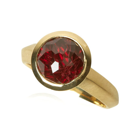 Karin jacobson jewelry design sunburst cut rhodolite garnet round bezel set solitaire ring in Fairmined™ 18k yellow gold.