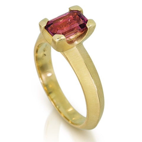 photo of Karin jacobson jewelry design Malawi pink tourmaline emerald cut prong set solitaire ring in Fairmined™ 18k yellow gold.